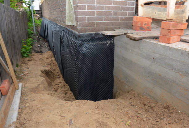 Happy homeowners after waterproofing job in Frankfort